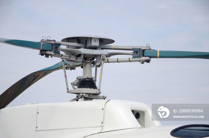 Fragment of helicopter screw engine close up against blue sky. Propeller of the ukrainian heli transporter