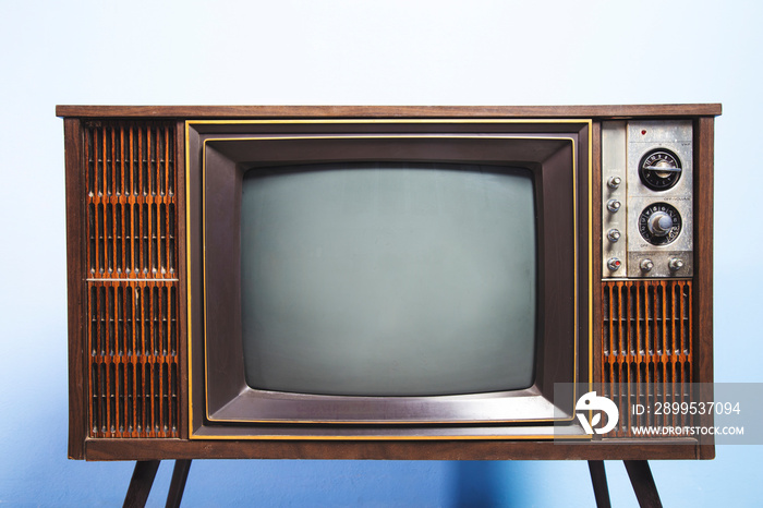 Retro old TV with a blank screen standing in the room, antique and vintage television photo.