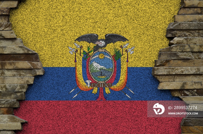 Ecuador flag depicted in paint colors on old stone wall closeup. Textured banner on rock wall background