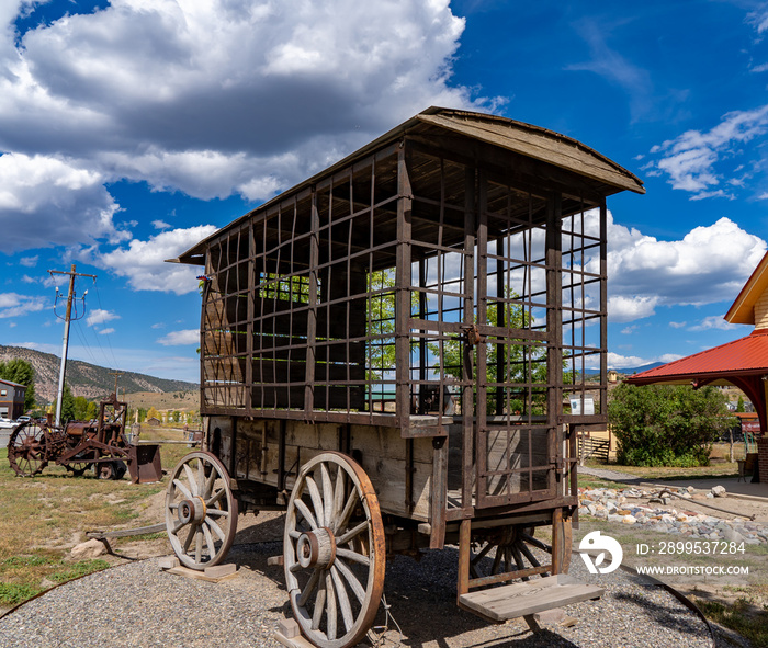 Horizontal image of an antique jail wagon