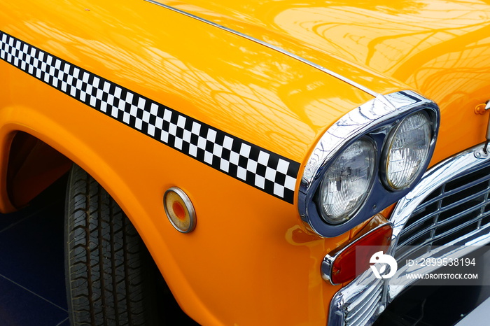 Details of the front of an old yellow cab of New York.