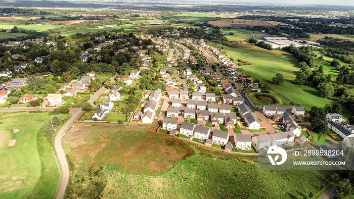 Aerial view over the village of Bridge of Weir and surrounding countryside.