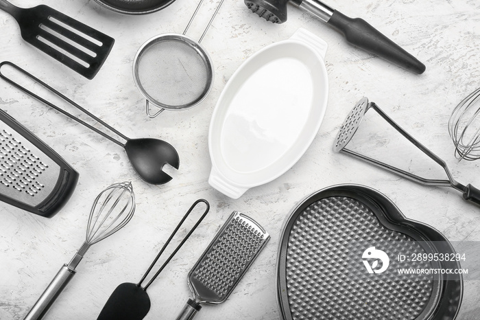 Set of kitchen utensils on light background