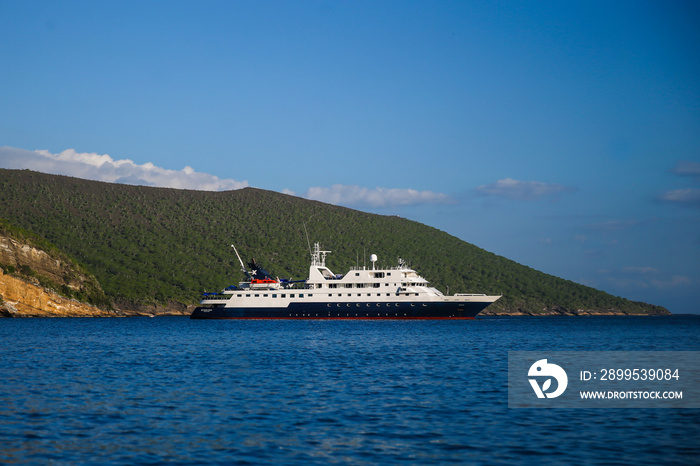 An expedition cruise ship anchored off the shores of the Galapagos Islands