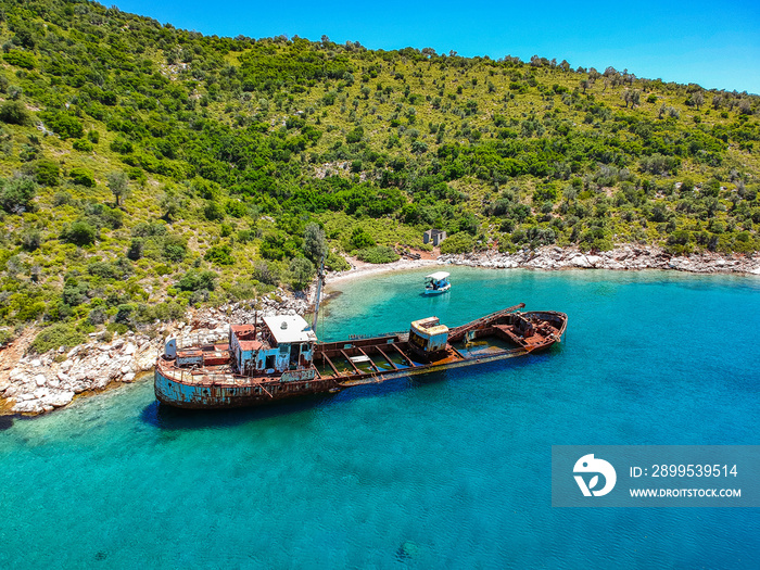 Aerial view over rusty shipwreck of an old cargo boat at Peristera island near Alonissos, Greece