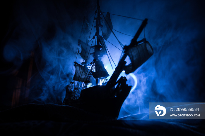 Black silhouette of the pirate ship in night