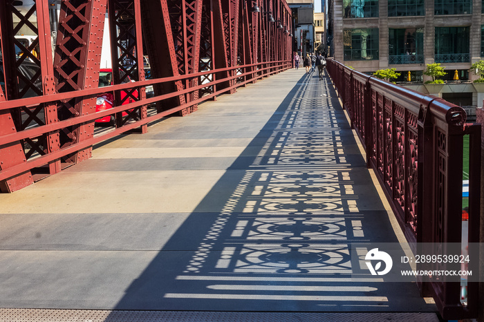 Shadows of the bridge railing design on Wells Street drawbridge in downtown Chicago Loop