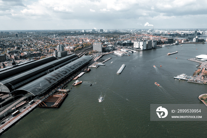 Aerial view of Central Station. The name of Amsterdam is written in huge letters on the roof of the central station.