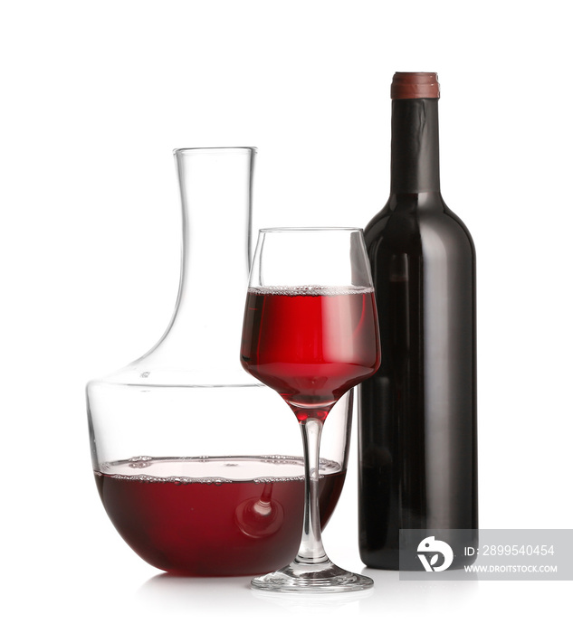 Decanter, glass and bottle of wine on white background