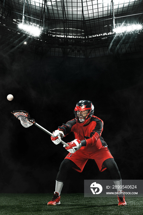 Lacrosse Player, athlete sportsman in red helmet on grand arena background. Sport and motivation wallpaper.