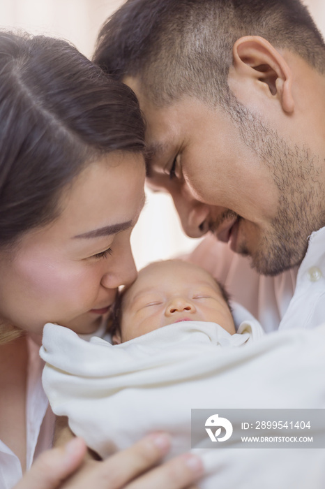 Asian parents with newborn baby, Close up portrait of asian young couple father and mother holding their new born baby in hospital. Happy family love newborn nursery mother’s day holiday concept