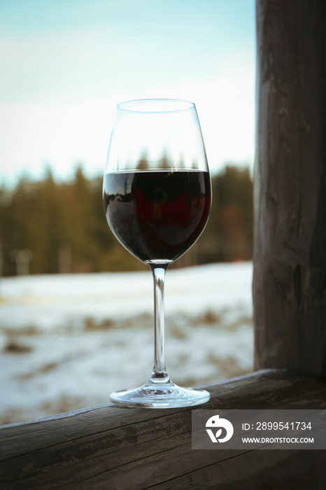 Glass of wine outdoor in winter day