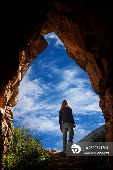 Coming out of the tunnel of the underground cistern in Ancient Mycenae ( Mykines ), Argolis (Argolida), Peloponnese.