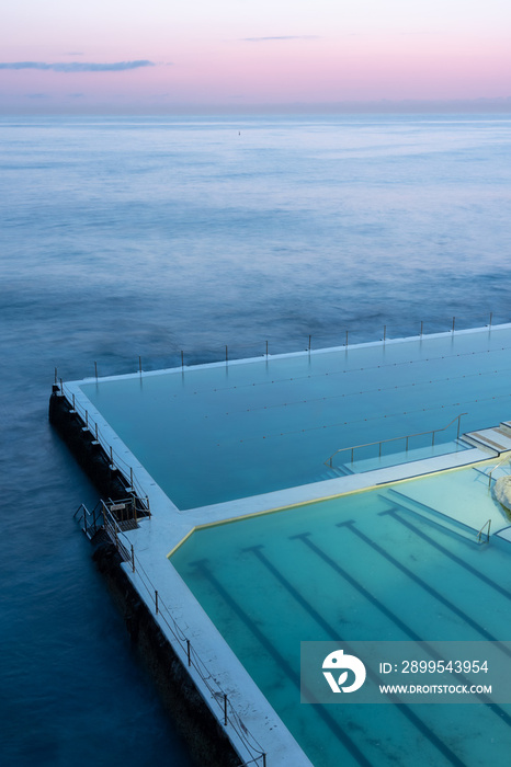 Sydney’s famous Bondi Icebergs swimming pool at sunrise with pastel sky