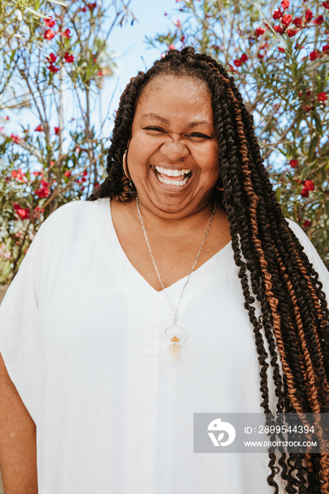 close up portrait of a plus size afro latinx haitian american woman smiling