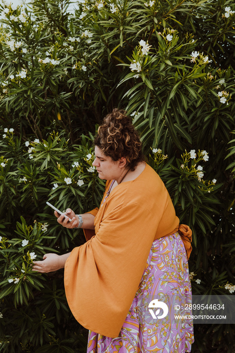 plus size woman takes photos of plants