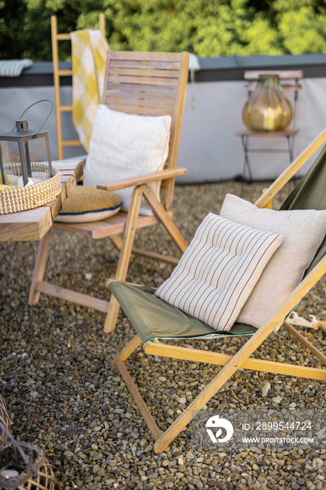 Beautiful wooden chairs with pillows on a rooftop, chilling place outdoor