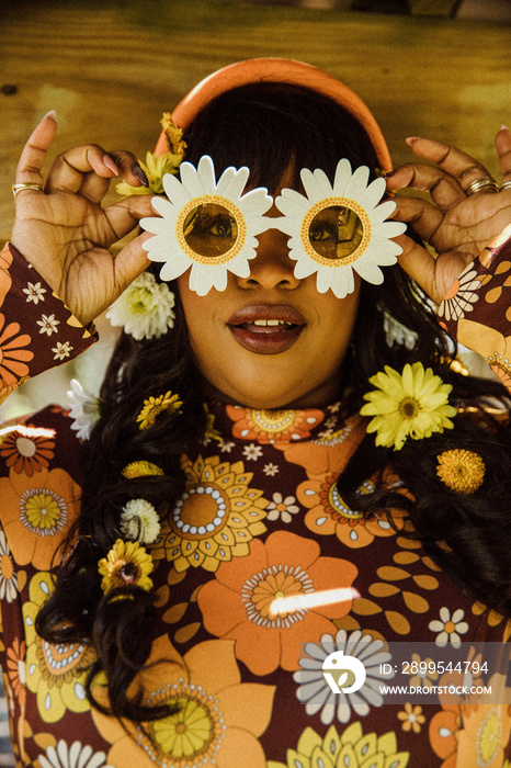 closeup of plus size Black woman wearing sunflower glasses