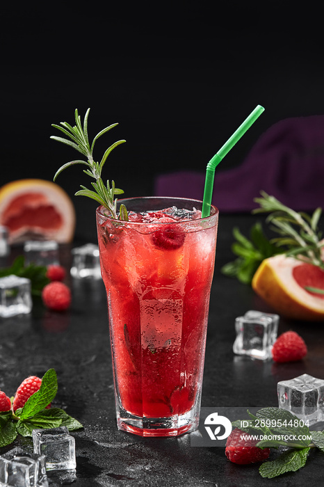 Raspberry and rhubarb lemonade with ice and rosemary