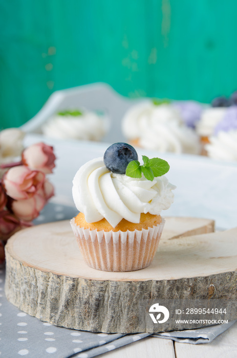 Summer cupcakes with blueberries and mint flavoured cream. Homemade.