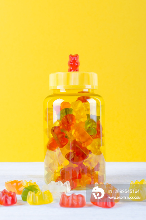 vitamins for children like jelly candy on yellow background