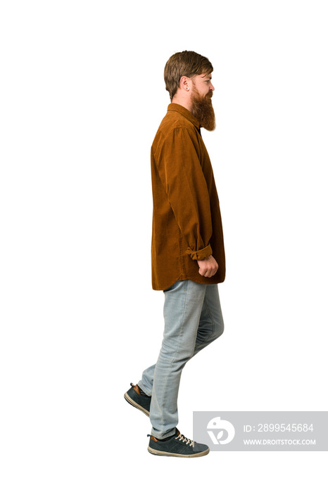 Adult redhead man walking cut out isolated