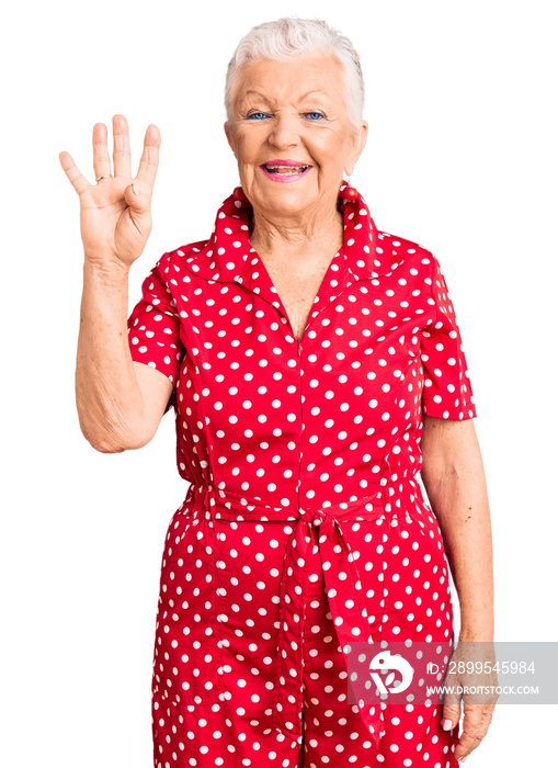 Senior beautiful woman with blue eyes and grey hair wearing a red summer dress showing and pointing up with fingers number four while smiling confident and happy.