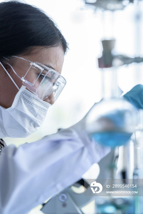 Asian young girl student scientist researching  and learning in a laboratory.