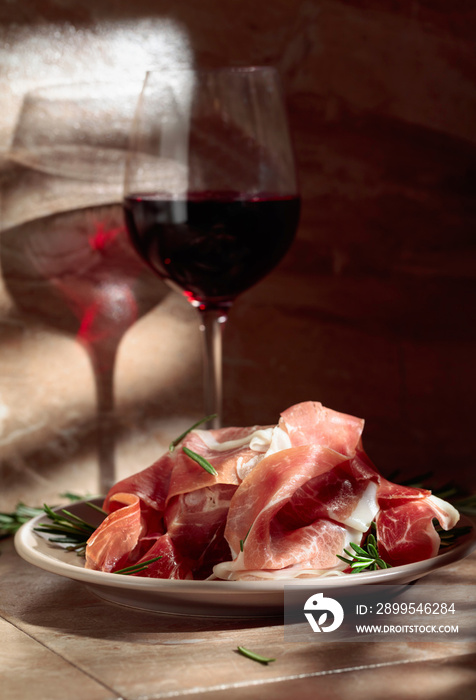 Prosciutto or Spanish jamon with rosemary and red wine.