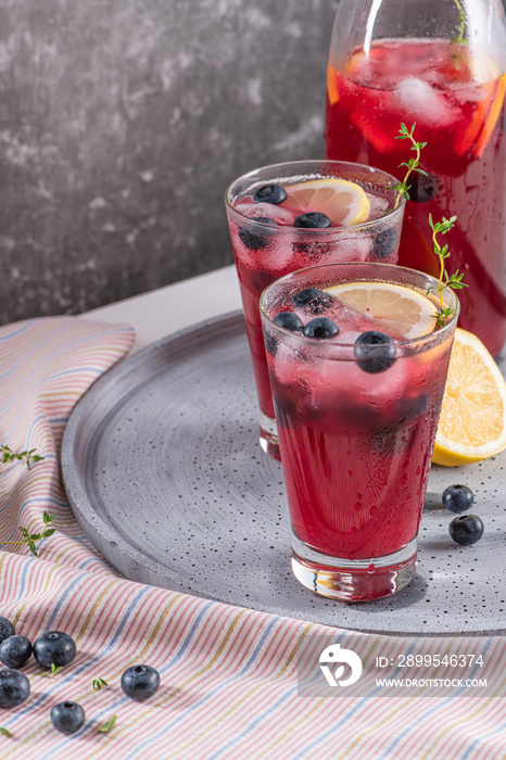 Fresh blueberry summer mojito cocktail. Blueberry lemonade or sangria on kitchen countertop