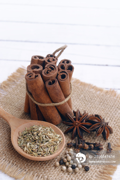 five spices to make chinese five-spice powder. five spice on wooden background.