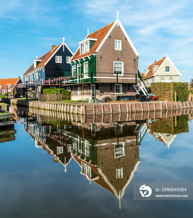 Traditional Dutch house mirrored in the water