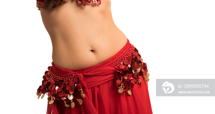 Beautiful belly dancer young woman in gorgeous red and gold costume dress. Part of body