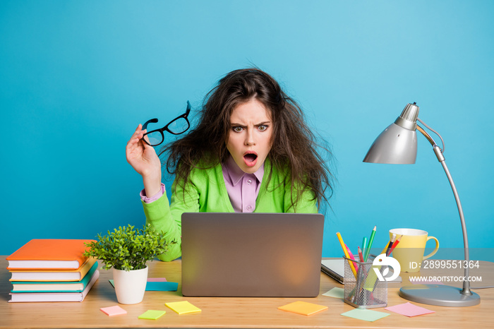 Portrait of her she nice attractive stunned brunette girl analyzing working hard isolated over bright blue color background