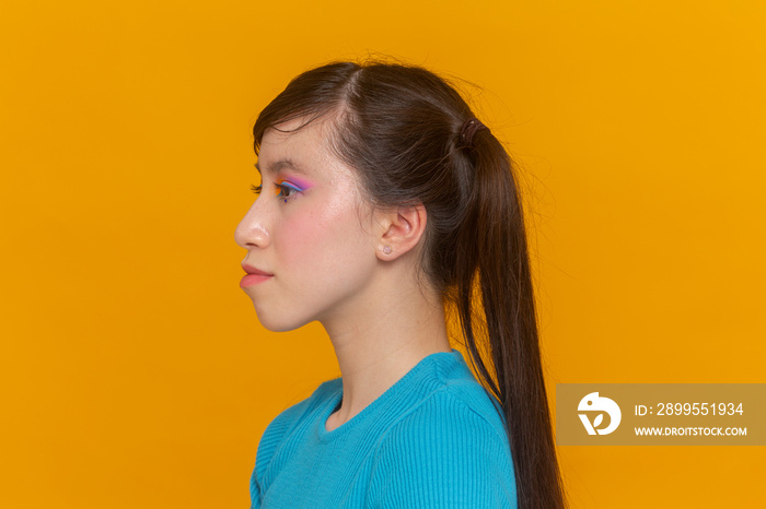 Profile of girl with colorful make-up