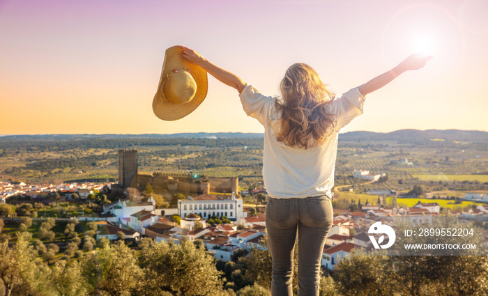 woman tourist, arms raised enjoying Alentejo region in Portugal- Portel