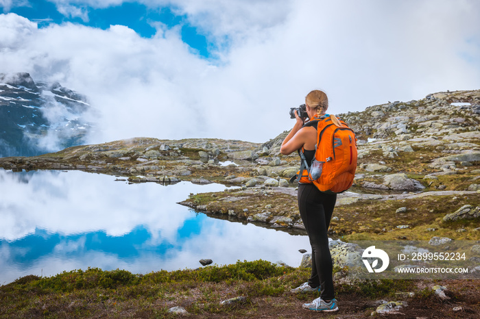 Nature photographer tourist near Norway lake