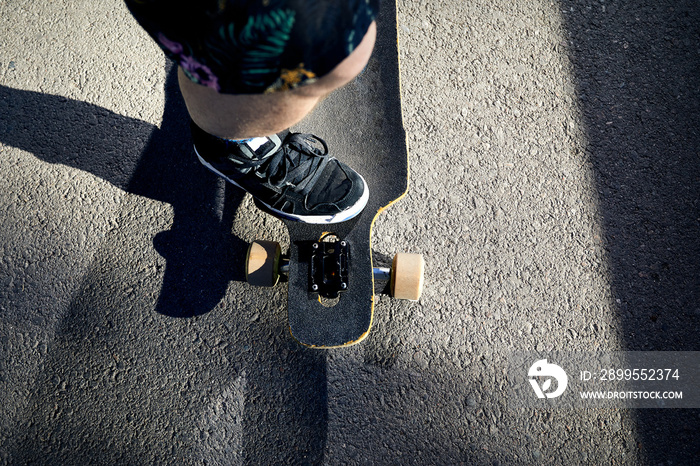 Skate boarder shoes close up on the road