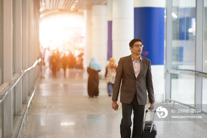 indian male walking at airport