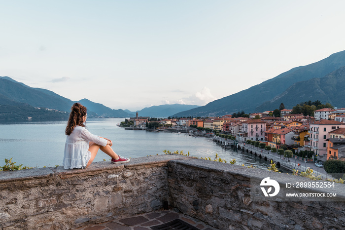 Girl looking at Gravedona city on Lake Como