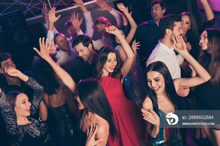 Attractive elegant trendy cheerful crowd dancing enjoying celebratory bachelor evening chill relax in dark night club indoors