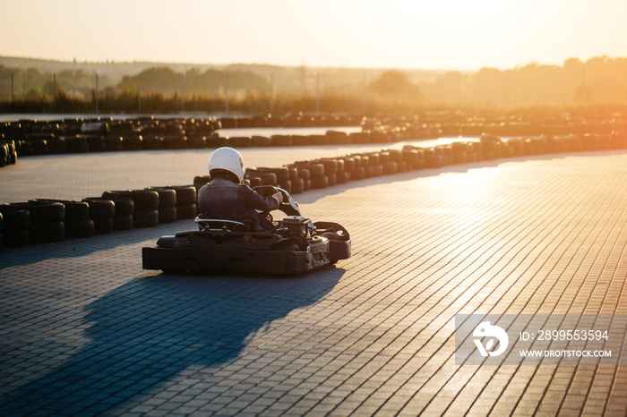 Karting competition or racing cars riding for victory on a racetrack