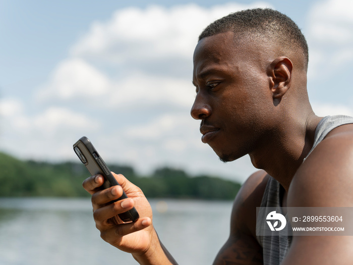 Man using smart phone outdoors