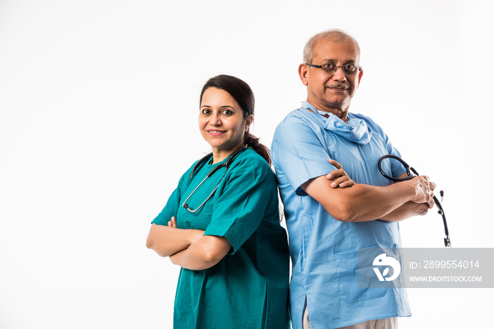 two Indian/asian surgeons / doctors standing isolated over white background