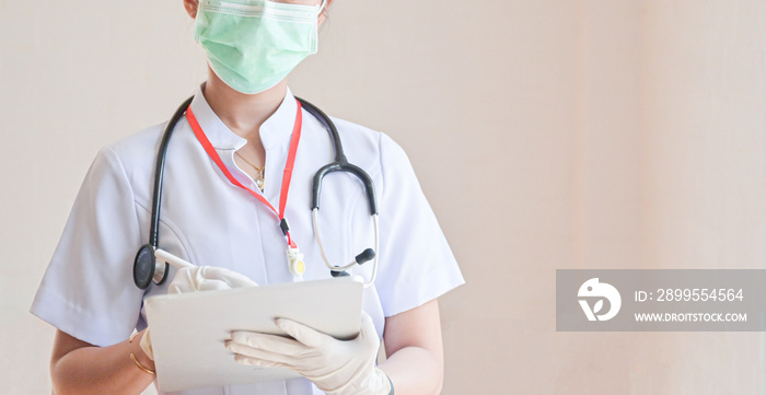 The doctor held a tablet in his hand to search for information about the patients treatment.