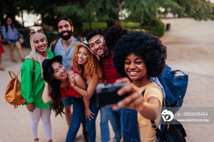 Group of tourists taking selfie abroad