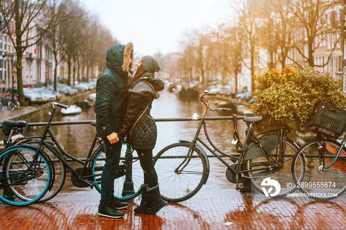 guy and girl in the street in the rain