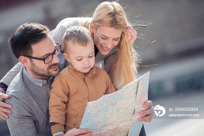 Happy family with map are ready to travel