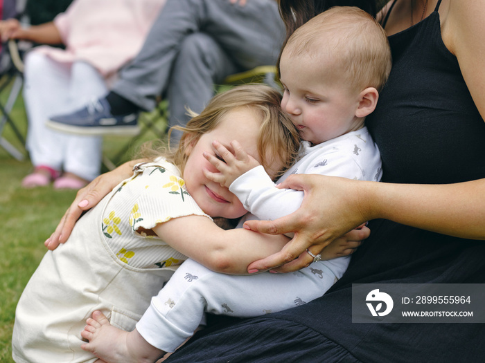 Mother with daughter and baby son