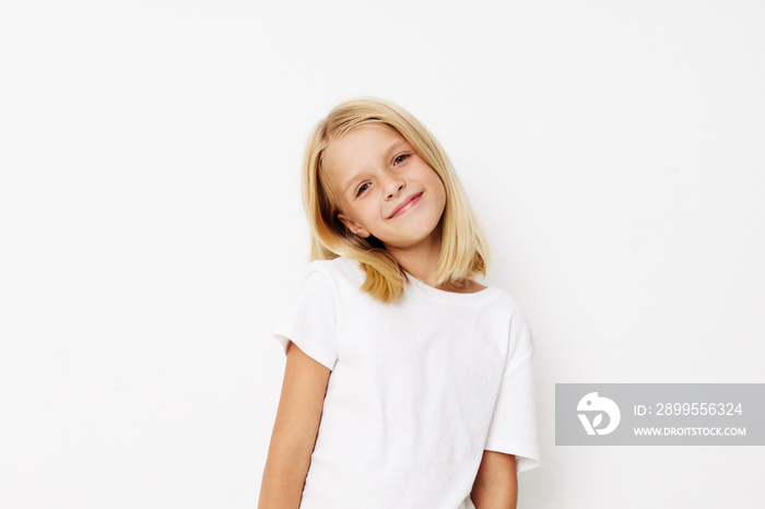 Portrait of a smiling little cutie hand gesture fun fashion on a light background